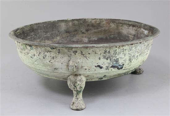 A Chinese archaic bronze tripod water basin, Pan, Warring States period, 4th/2nd century B.C., 39cm diameter, holes beneath rim